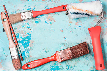 Image showing Paint Brushes On A Blue Wooden Background