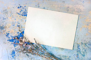 Image showing Blank Card And Dried Flowers On The Blue Wooden Background