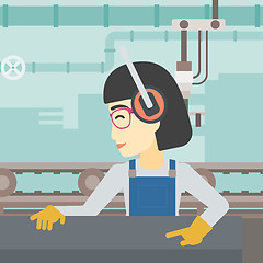Image showing Woman working on metal press machine.