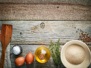 Image showing cooking ingredients on wooden table