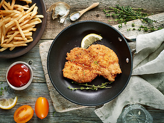 Image showing schnitzel on cooking pan