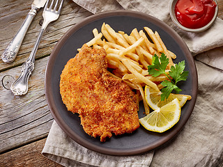 Image showing schnitzel and fried potatoes