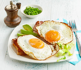 Image showing fried eggs on white plate