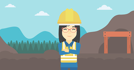 Image showing Miner with mining equipment on background.