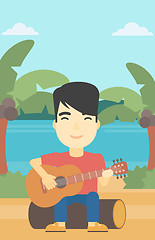 Image showing Musician playing acoustic guitar.