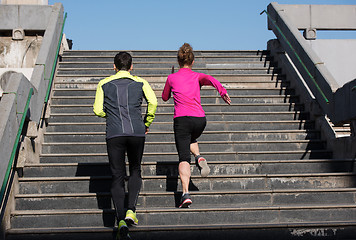 Image showing young  couple jogging on steps