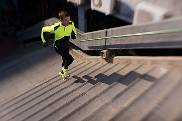 Image showing man jogging on steps