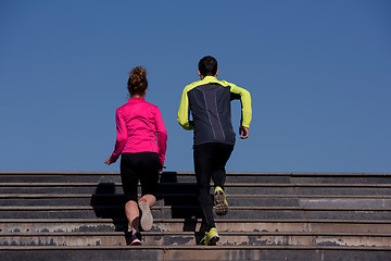 Image showing young  couple jogging on steps