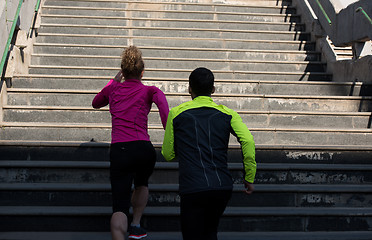 Image showing young  couple jogging on steps