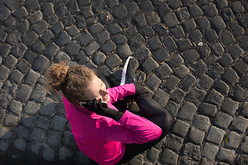 Image showing woman  stretching before morning jogging