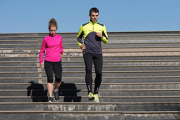 Image showing young  couple jogging on steps