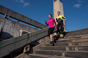 Image showing young  couple jogging on steps