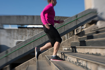 Image showing woman jogging on  steps