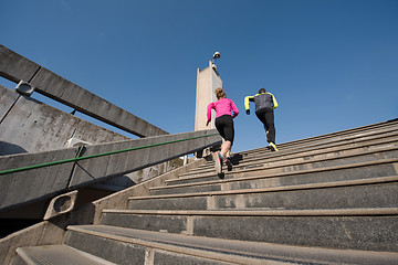 Image showing young  couple jogging on steps