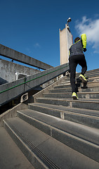 Image showing man jogging on steps