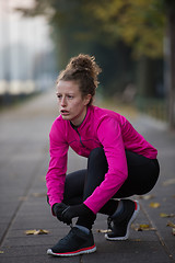 Image showing woman  stretching before morning jogging