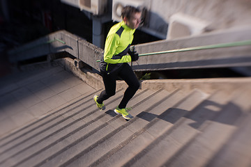 Image showing man jogging on steps