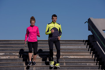 Image showing young  couple jogging on steps