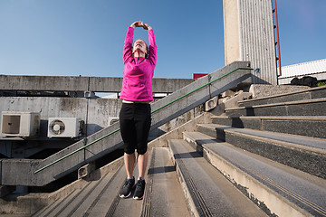 Image showing woman  stretching before morning jogging