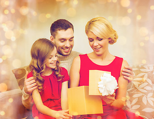 Image showing happy family opening gift box