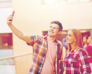 Image showing group of smiling students outdoors