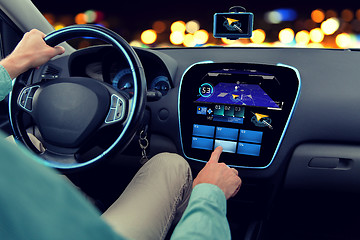 Image showing close up of man driving car with navigation system