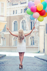 Image showing woman with colorful balloons