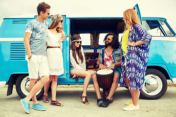 Image showing hippie friends with tom-tom playing music over car