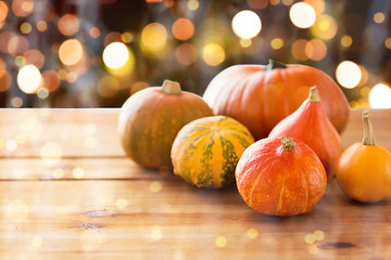 Image showing close up of halloween pumpkins on wooden table