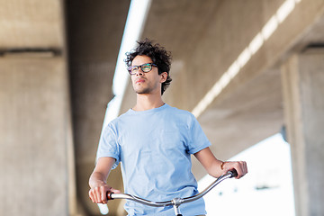 Image showing young hipster man riding fixed gear bike