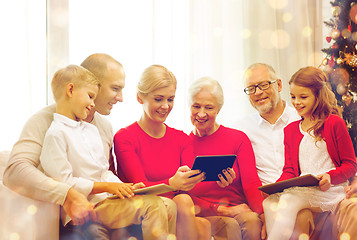 Image showing smiling family with tablet pc computers at home