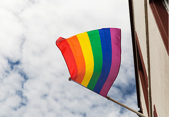 Image showing close up of rainbow gay pride flag waving on building