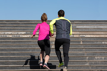 Image showing young  couple jogging on steps