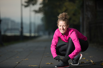 Image showing woman  stretching before morning jogging