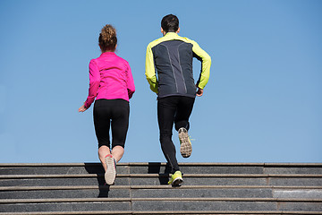 Image showing young  couple jogging on steps