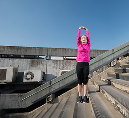 Image showing woman  stretching before morning jogging