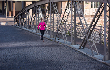 Image showing sporty woman jogging on morning