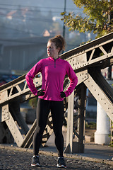 Image showing woman  stretching before morning jogging