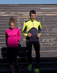 Image showing young  couple jogging on steps