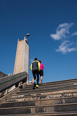 Image showing young  couple jogging on steps