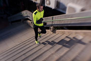 Image showing man jogging on steps