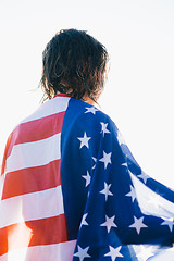 Image showing Back view of wet-haired woman in american flag