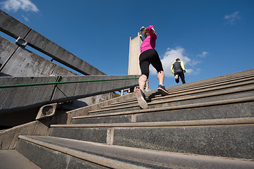 Image showing sporty woman jogging on morning