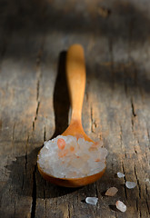 Image showing Pink himalayan salt on wooden table