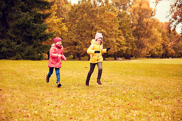 Image showing group of happy little girls running outdoors