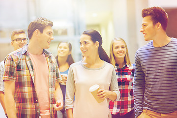 Image showing group of smiling students with paper coffee cups