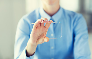 Image showing close up of woman with transparent smartphone