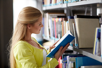 Image showing high school student girl reading book at library