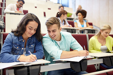 Image showing group of students with notebooks at lecture hall