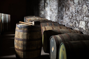 Image showing close up of old wooden barrel in wine cellar